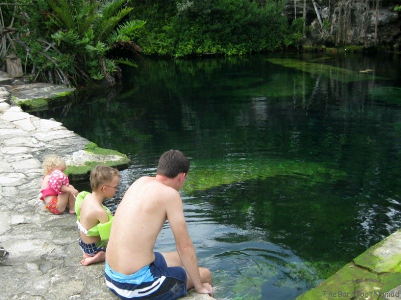 Dangling our toes in cenote Cristalino Playa del Carmen kids activities children