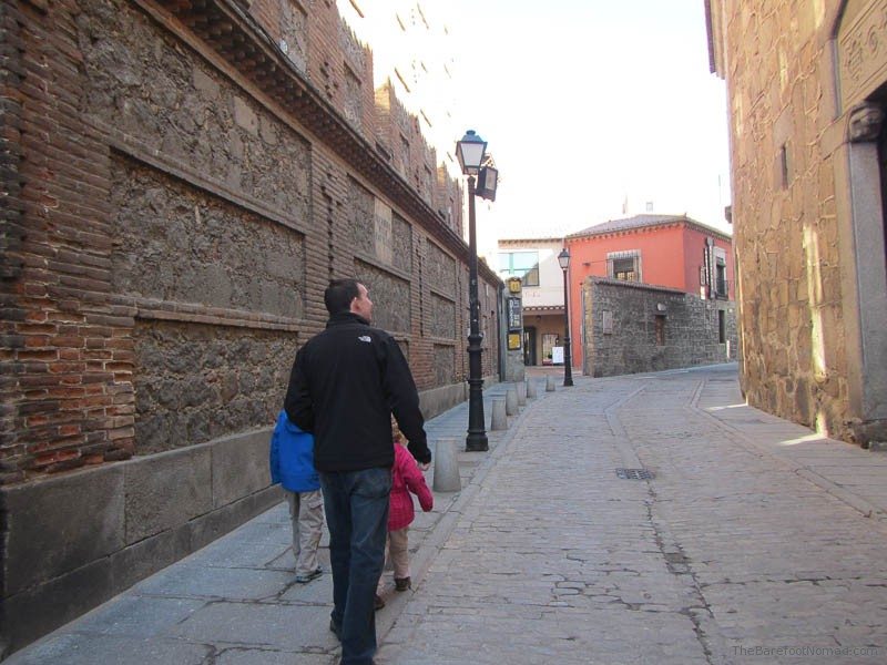 Charles Kosman and the kids walking down a lane in Avila, Spain