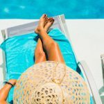 Tips to beat the heat this summer woman in lounge chair by pool