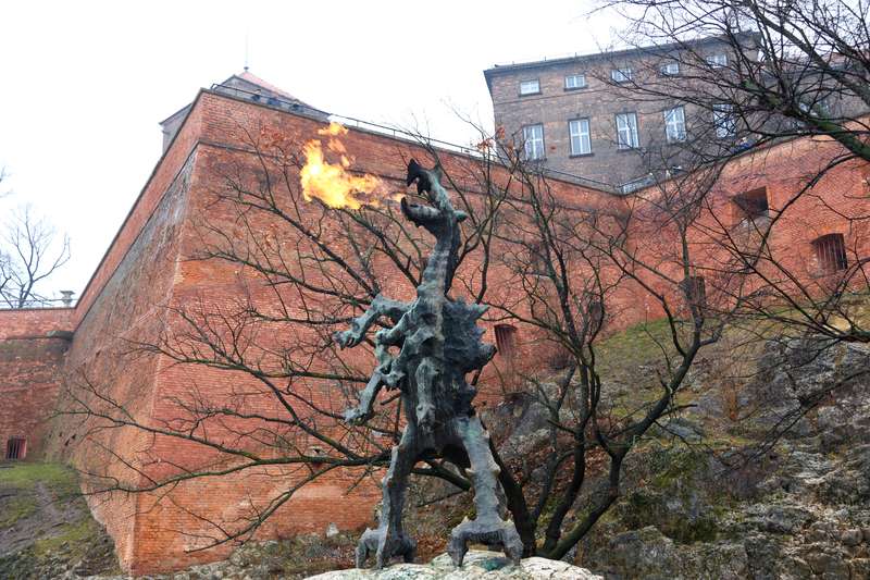 Dragon Statueflame from mouth in the old city of Krakow Poland